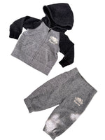 Load image into Gallery viewer, A baby clothing set laid flat on a light surface, including a zip-up hoodie and jogger pants. The hoodie is heather gray with black sleeves and hood, and the pants are heather gray with a small white embroidered logo on the thigh.
