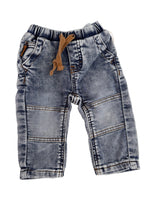 Load image into Gallery viewer, A pair of faded light blue denim jeans for toddlers, laid flat on a white background. The jeans feature a light wash with darker blue shading, classic front patch pockets, and a brown fabric drawstring at the elastic waistband.
