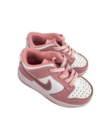 Load image into Gallery viewer, A pair of Nike Dunk Low sneakers in a dusty pink and white colorway, shown from a top-down angle on a light gray background.
